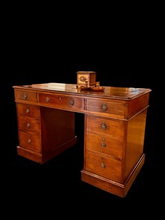 A Beautiful English 19th Century Mahogany Pedestal Desk having an old Leather.