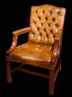 An English Antique Green leather Gainsborough Armchair. Ca 1900.