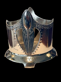 An English Art Nouveau Silver Plated Bottle Holder.
