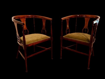 An English Edwardian Pair of mahogany Tub Chairs having Satinwood Inlay