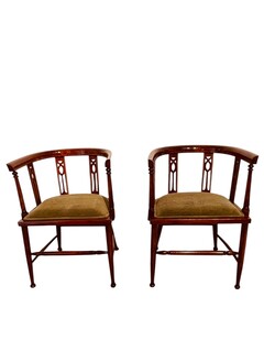 An English Edwardian Pair of Mahogany Tub Chairs having Satinwood Inlay.