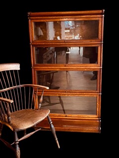 An English End 19th Century Oak Globe Wernicke Bookcase and An English 18th Century Stick Back Chair.