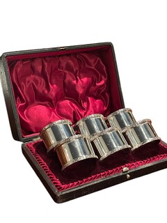 An English Set of Six Plated Silver Napkin Rings in Original Fitted Case .